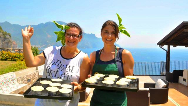 Lara and Claudia serve up some delicious Italian food they cooked at the Amalfi Villa. 